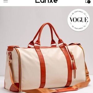 Cream and Tan Duffel Bag with Spacious Interior and Durable Design